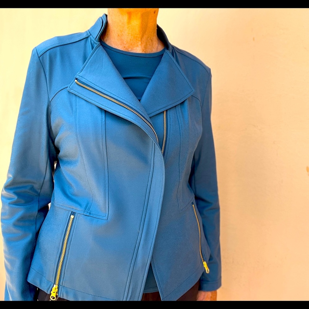 Faux leather. Light weight. Fabric 95% poly 5% spandex. Hand wash.